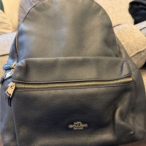 Coach Black Leather Men's Backpack with Gold Accents
